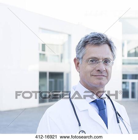 Stock Image - Portrait of confident doctor. Fotosearch