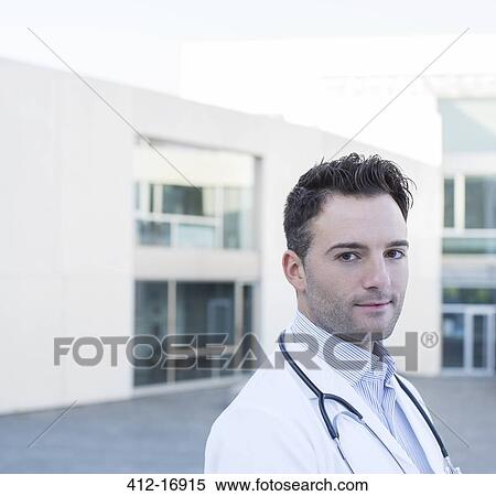 Stock Photography - Portrait of confident doctor. Fotosearch