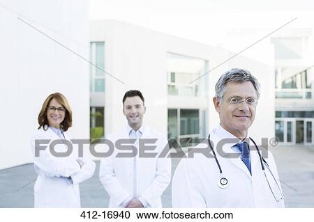 Portrait of confident doctors on rooftop View Large Photo Image Stock Image - Portrait of confident doctors on rooftop. Fotosearch