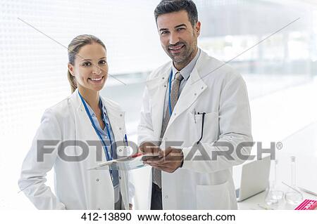 Portrait of confident doctors View Large Photo Image Stock Image - Portrait of confident doctors. Fotosearch