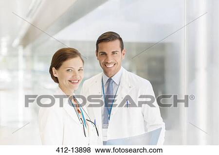 Stock Photo - Portrait of confident doctors. Fotosearch