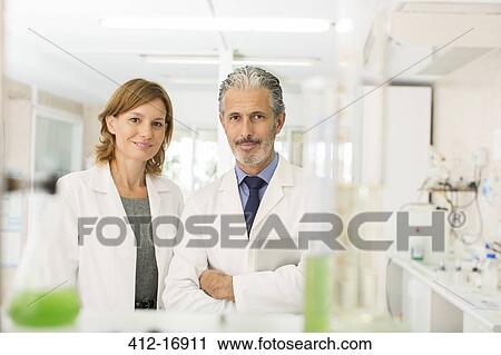 Stock Image - Portrait of confident scientists in laboratory. Fotosearch