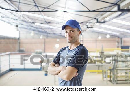 Portrait of confident worker in food processing plant View Large Photo Image Stock Image - Portrait of confident worker in food processing plant. Fotosearch