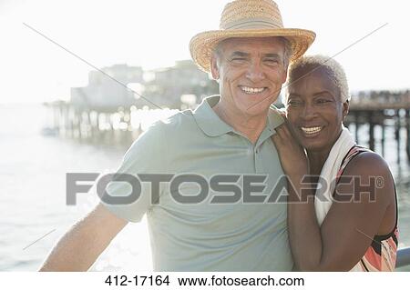 Picture - Portrait of happy senior couple on beach. Fotosearch