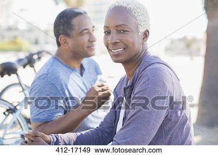 Portrait of smiling couple outdoors View Large Photo Image Stock Photo - Portrait of smiling couple outdoors. Fotosearch