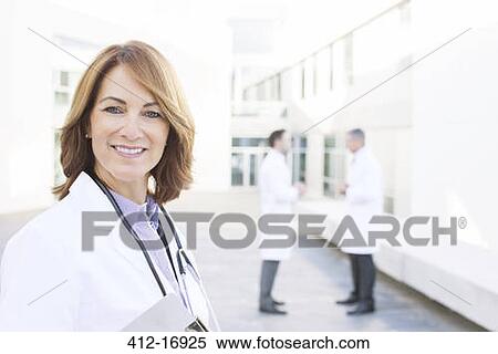 Portrait of smiling doctor View Large Photo Image Stock Photography - Portrait of smiling doctor. Fotosearch