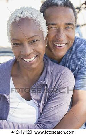 Stock Image - Portrait of smiling senior couple. Fotosearch