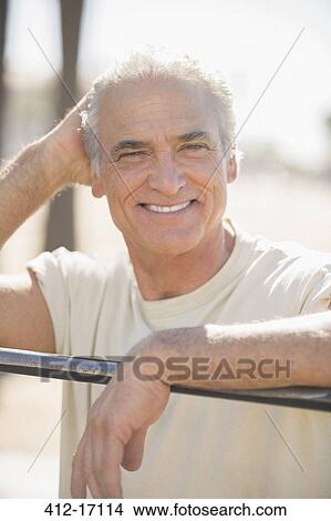 Picture - Portrait of smiling senior man outdoors. Fotosearch