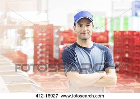 Portrait of worker in food processing plant View Large Photo Image Stock Photo - Portrait of worker in food processing plant. Fotosearch