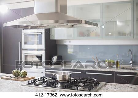 Pot on gas stove in luxury domestic kitchen View Large Photo Image Stock Image - Pot on gas stove in luxury domestic kitchen. Fotosearch