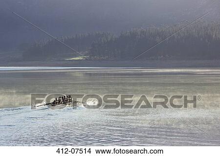 Rowing crew rowing scull on lake View Large Photo Image Picture - Rowing crew rowing scull on lake. Fotosearch