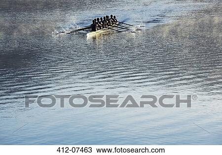 Rowing team rowing scull on lake View Large Photo Image Stock Image - Rowing team rowing scull on lake. Fotosearch