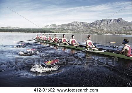 Rowing team rowing scull on lake View Large Photo Image Stock Image - Rowing team rowing scull on lake. Fotosearch