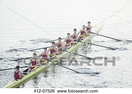 Rowing team rowing scull on lake View Large Photo Image Stock Photograph - Rowing team rowing scull on lake. Fotosearch