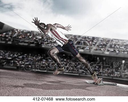 Stock Photo - Runner taking off from starting block on track. Fotosearch