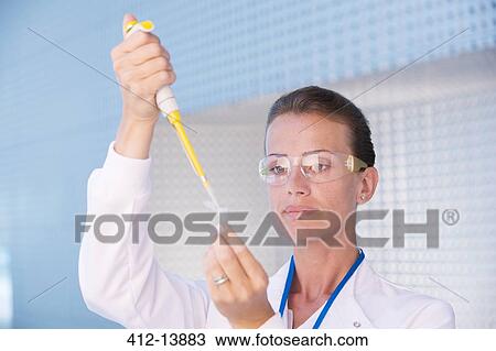 Scientist using pipette View Large Photo Image Stock Image - Scientist using pipette. Fotosearch