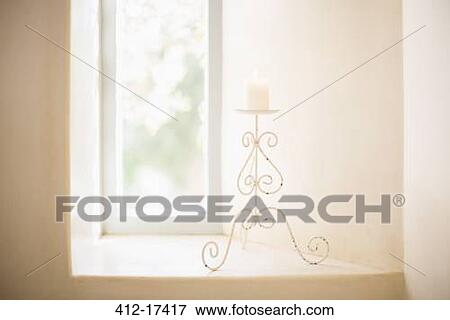Scroll candleholder in sunny window View Large Photo Image Stock Photo - Scroll candleholder in sunny window. Fotosearch