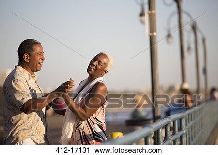 Senior couple dancing on pier View Large Photo Image Stock Image - Senior couple dancing on pier. Fotosearch