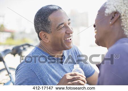 Senior couple laughing outdoors View Large Photo Image Stock Photo - Senior couple laughing outdoors. Fotosearch