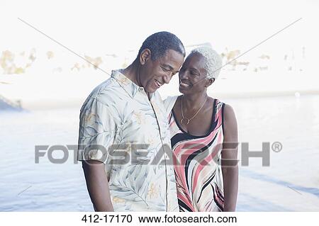 Senior couple walking on beach View Large Photo Image Stock Image - Senior couple walking on beach. Fotosearch