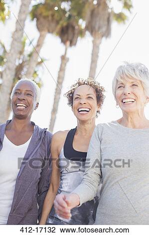 Stock Image - Senior women power walking outdoors. Fotosearch