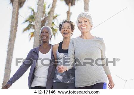 Stock Photograph - Senior women walking outdoors. Fotosearch
