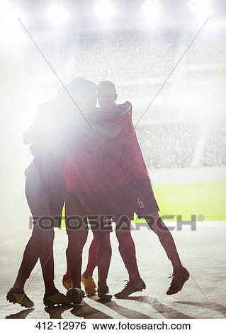 Silhouette of soccer team celebrating View Large Photo Image Stock Photograph - Silhouette of soccer team celebrating. Fotosearch