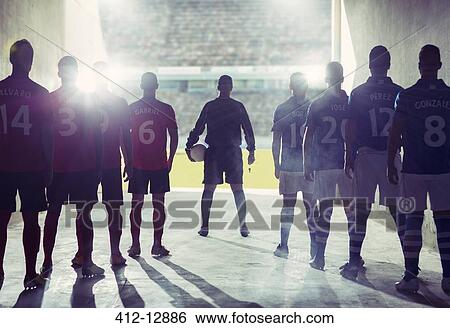 Silhouette of soccer teams facing field View Large Photo Image Stock Photograph - Silhouette of soccer teams facing field. Fotosearch