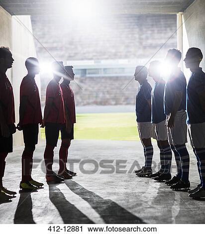Silhouette of soccer teams greeting in locker room View Large Photo Image Stock Image - Silhouette of soccer teams greeting in locker room. Fotosearch
