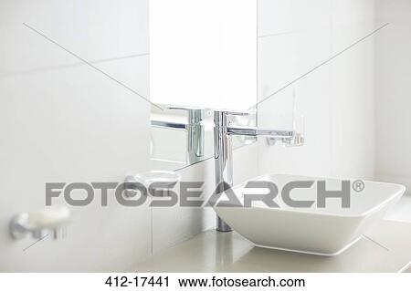 Stock Image - Sink in sunny modern bathroom. Fotosearch