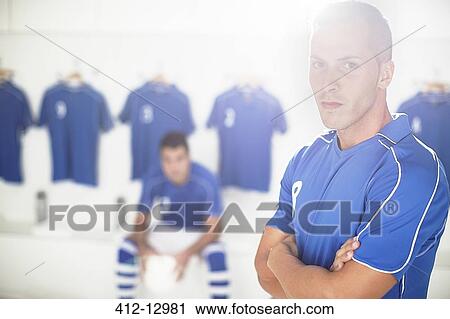 Soccer player standing in locker room View Large Photo Image Stock Image - Soccer player standing in locker room. Fotosearch