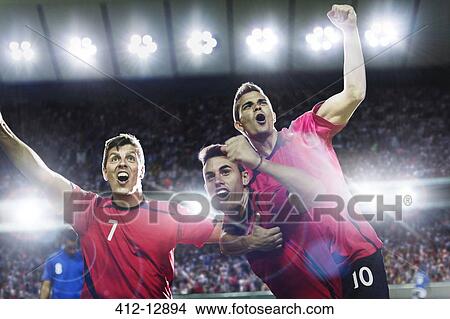 Soccer players celebrating on field View Large Photo Image Picture - Soccer players celebrating on field. Fotosearch