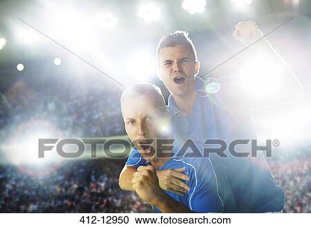 Soccer players celebrating on field View Large Photo Image Stock Image - Soccer players celebrating on field. Fotosearch
