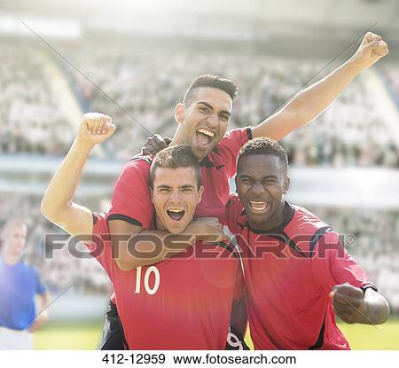 Soccer players celebrating on field View Large Photo Image Stock Photo - Soccer players celebrating on field. Fotosearch