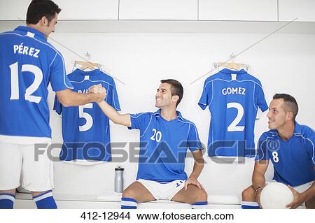 Soccer players shaking hands in locker room View Large Photo Image Picture - Soccer players shaking hands in locker room. Fotosearch