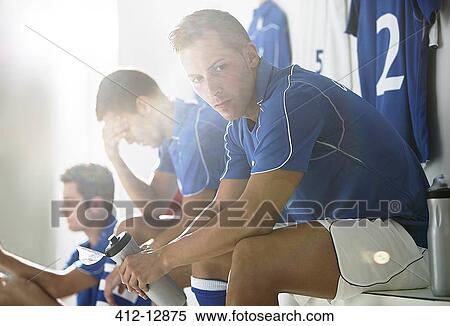 Soccer players sitting in locker room View Large Photo Image Stock Photography - Soccer players sitting in locker room. Fotosearch