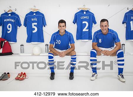 Stock Photo - Soccer players smiling in locker room. Fotosearch