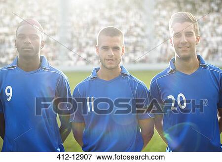 Soccer players smiling on field View Large Photo Image Stock Photo - Soccer players smiling on field. Fotosearch