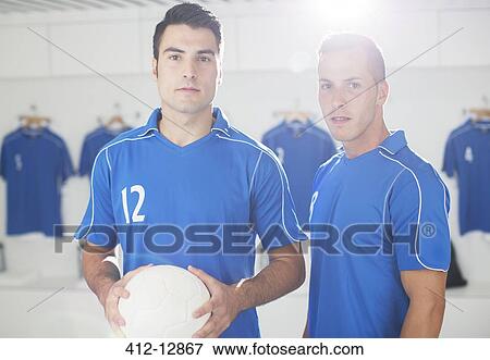 Stock Photo - Soccer players standing in locker room. Fotosearch