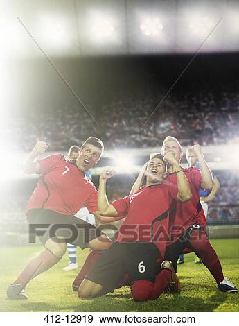 Soccer team celebrating on field View Large Photo Image Stock Photo - Soccer team celebrating on field. Fotosearch