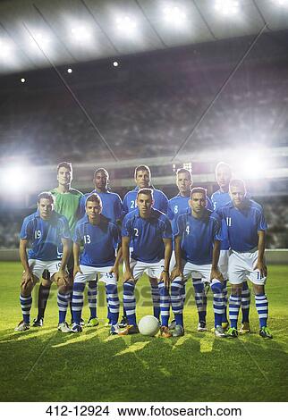 Picture - Soccer team posing on field. Fotosearch
