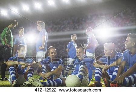 Soccer team relaxing on field View Large Photo Image Stock Image - Soccer team relaxing on field. Fotosearch