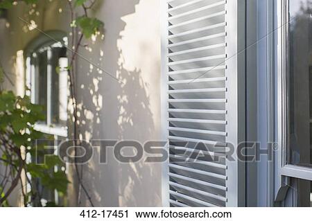 Sun shining on house shutters View Large Photo Image Stock Image - Sun shining on house shutters. Fotosearch