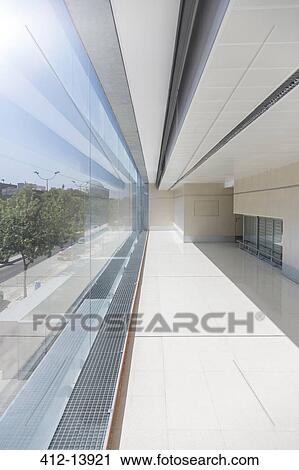 Sun shining on windows of modern building View Large Photo Image Stock Image - Sun shining on windows of modern building. Fotosearch