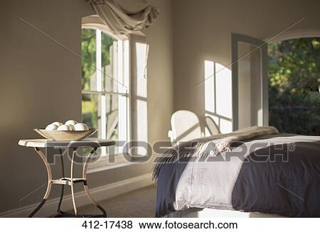 Stock Photo - Sunny luxury bedroom. Fotosearch