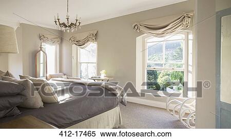 Stock Photography - Sunny luxury bedroom. Fotosearch