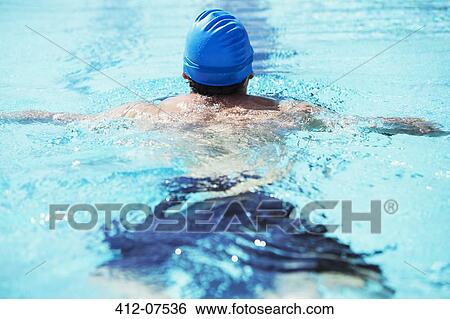 Swimmer floating in pool View Large Photo Image Stock Photograph - Swimmer floating in pool. Fotosearch