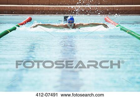 Swimmer racing in pool View Large Photo Image Stock Image - Swimmer racing in pool. Fotosearch