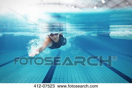 Swimmer racing in pool View Large Photo Image Stock Image - Swimmer racing in pool. Fotosearch