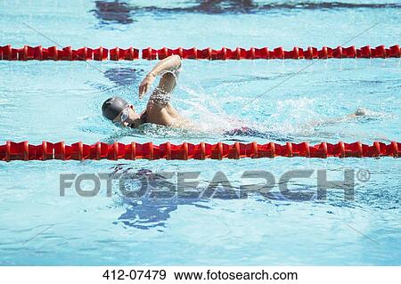 Swimmer racing in pool View Large Photo Image Stock Photo - Swimmer racing in pool. Fotosearch